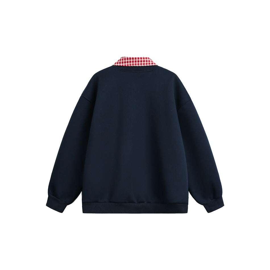 Back view of a navy snap-front jacket with a red-and-white gingham collar.