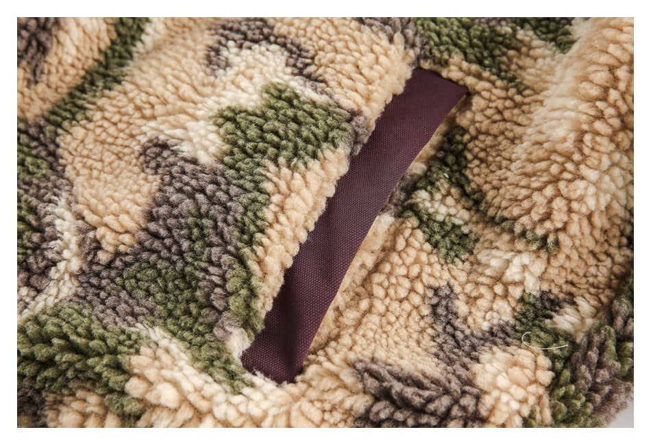 Close-up of a burgundy-trimmed pocket opening on the camouflage sherpa jacket.