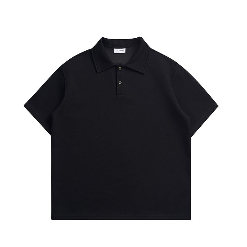 Black short-sleeve polo shirt with fold-over collar and two buttons, flat lay front view