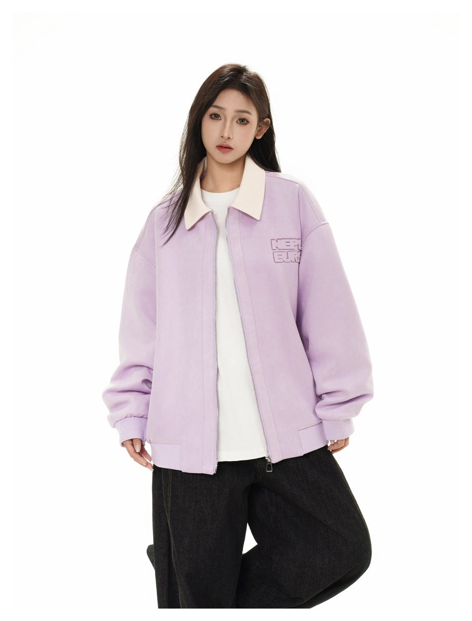 Closer front view of a model wearing a lilac jacket with a cream collar and outlined chest lettering.