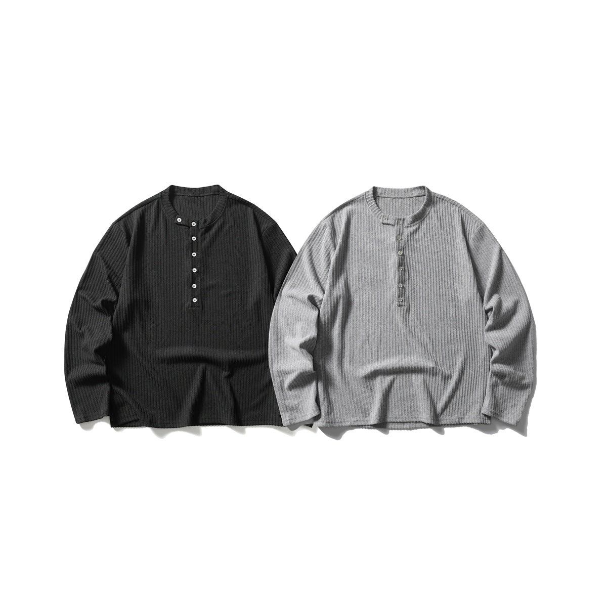 Two long-sleeve ribbed henley shirts shown from the front, one black and one heather gray.