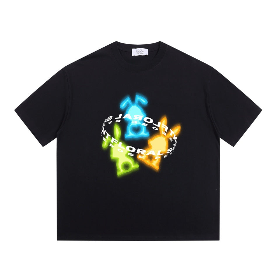Black short-sleeve crew neck T-shirt with a neon blue, green and orange rabbit graphic and curved lettering ring