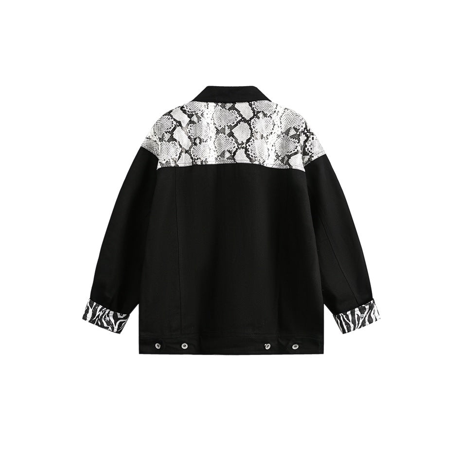 Back view of a black jacket with a snakeskin-print yoke and zebra-print turned-back cuffs.