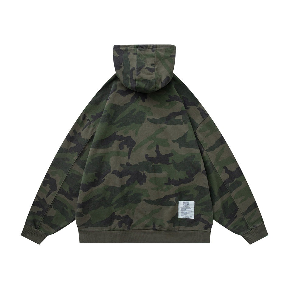 Back view of a green woodland camouflage hoodie with a hood, ribbed cuffs and hem, and a small sewn-in label.