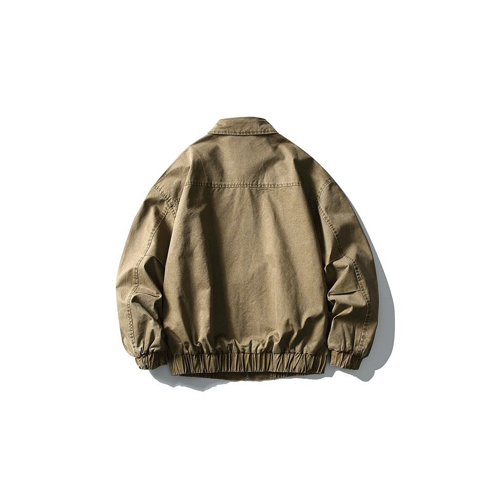 Back view of a tan-brown zip jacket with a collar, seam across the shoulders, and elastic hem and cuffs.