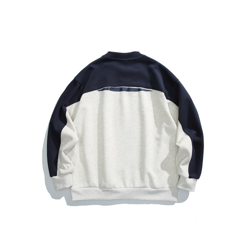 Back of an ivory and navy color-block crewneck sweatshirt, with a navy upper back and sleeves.