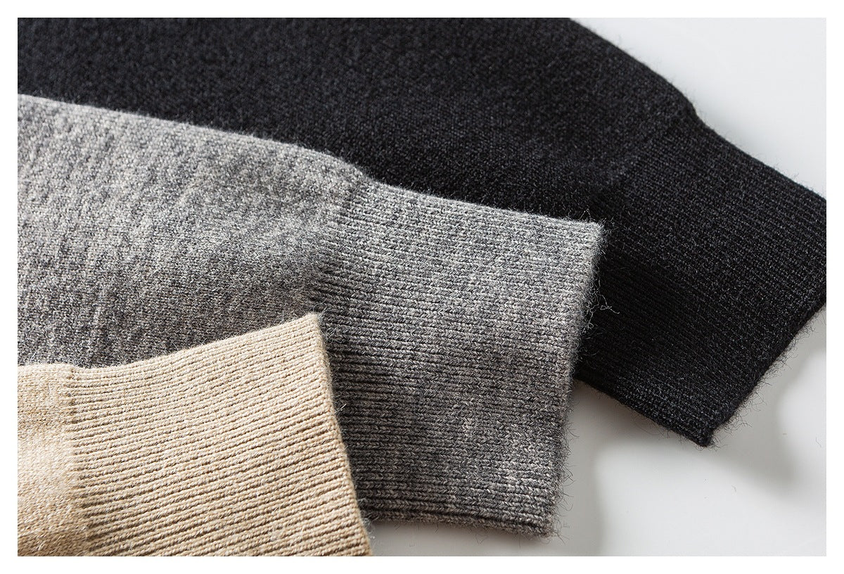 Close-up of ribbed knit cuffs in black, gray, and beige colorways, layered together.