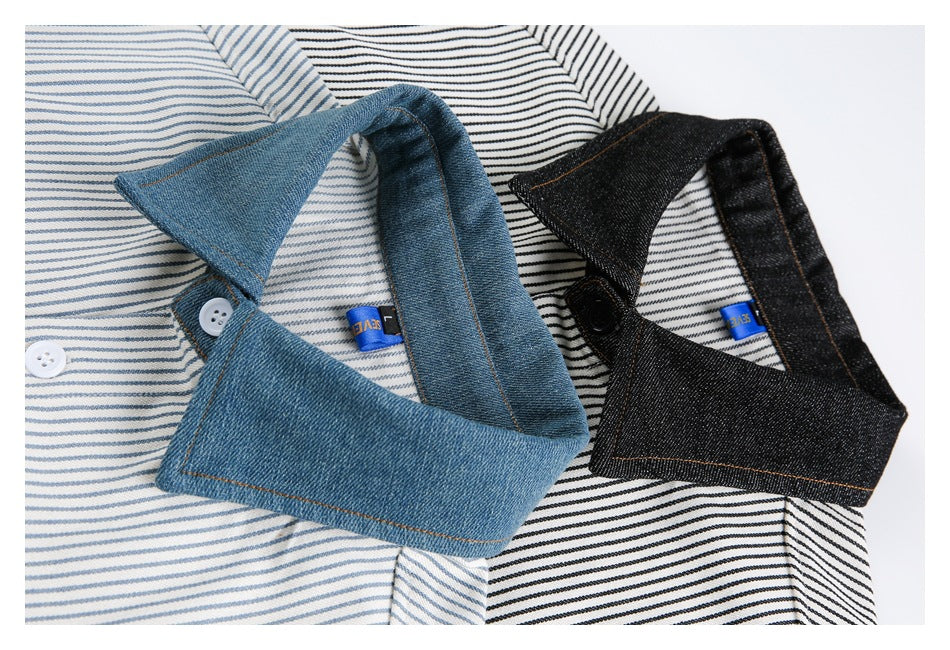 Close-up of blue and black denim-style shirt collars over fine striped fabric, with visible buttons and small blue labels.