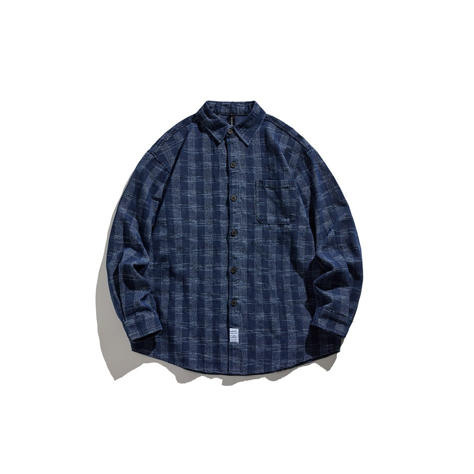 Washed blue textured plaid long-sleeve button-up shirt with chest pocket, laid flat, front view