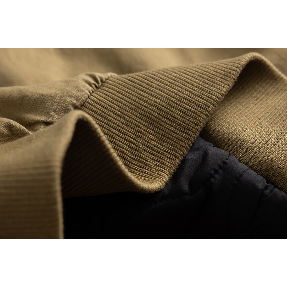 Close-up of the jacket's ribbed brown collar and inner black lining.