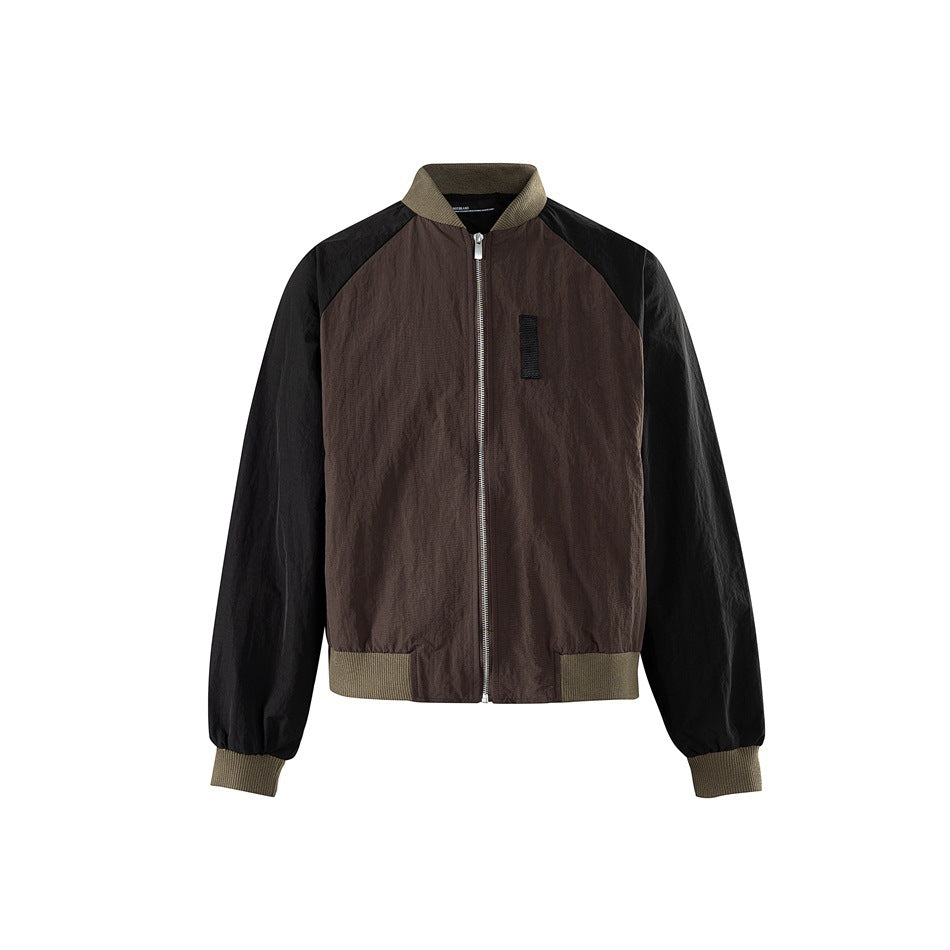 Front of brown and black bomber jacket with olive ribbed collar, cuffs and hem and a silver front zipper