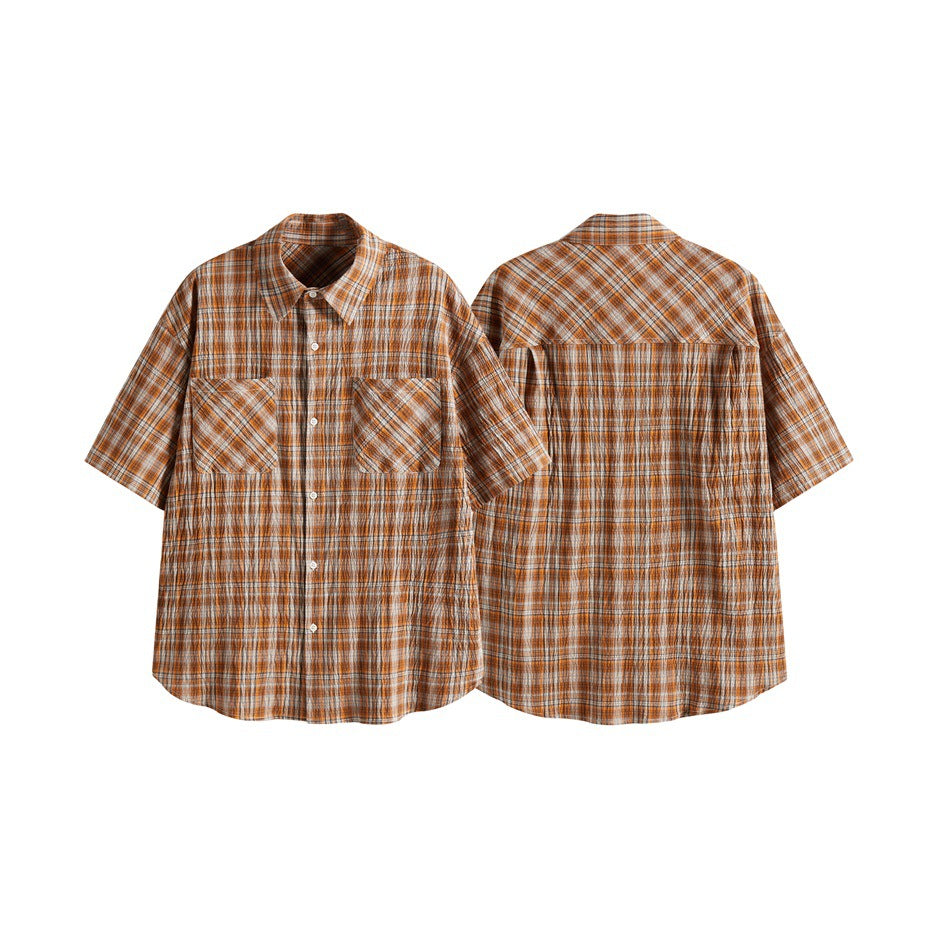 Short-sleeve orange plaid button-up shirt shown from the front and back, with two chest pockets.