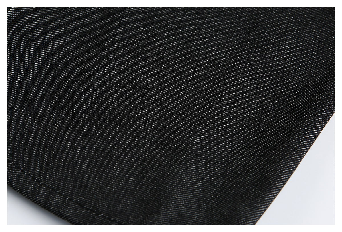 Close-up of the black fabric surface and fine woven texture.