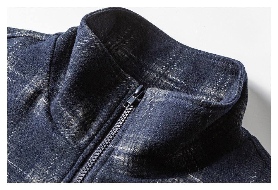 Close-up of the dark navy plaid jacket's stand collar and front zipper.