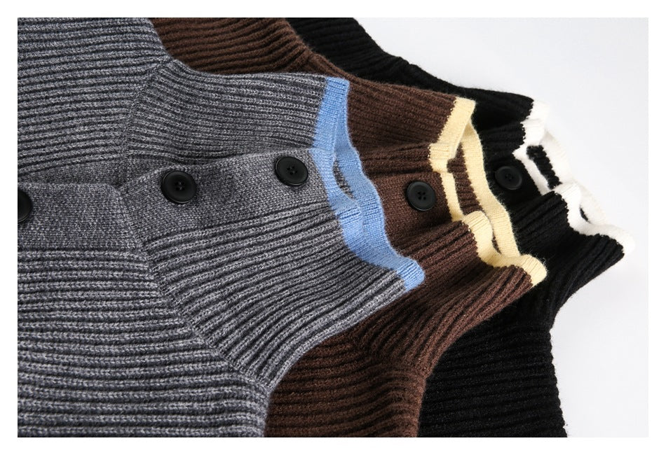 Three ribbed sweaters arranged together in gray with blue trim, brown with cream trim, and black with white trim.