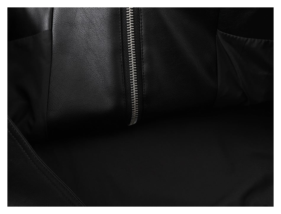 Close-up of the black jacket's inner lining and a vertical silver zipper.