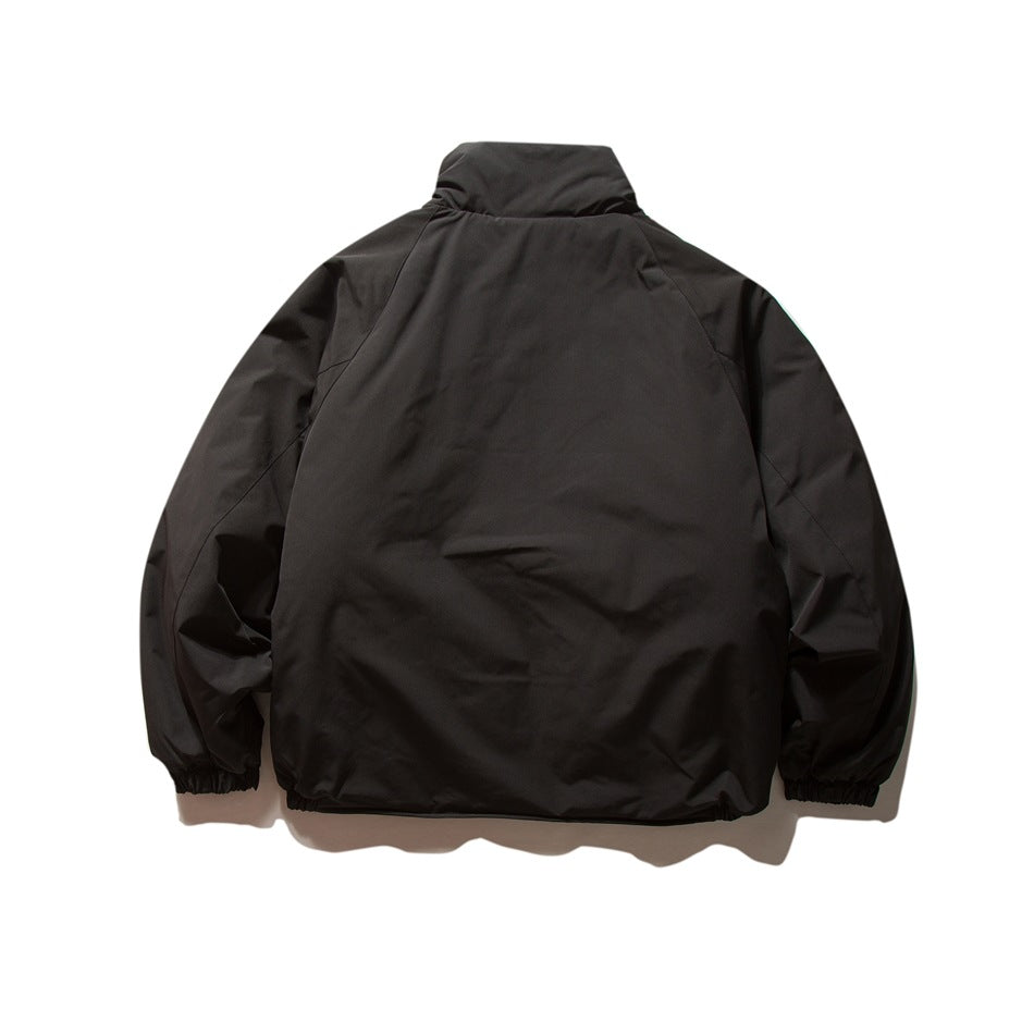 Back view of a black jacket with a high collar, raglan sleeves, and elasticated cuffs and hem.