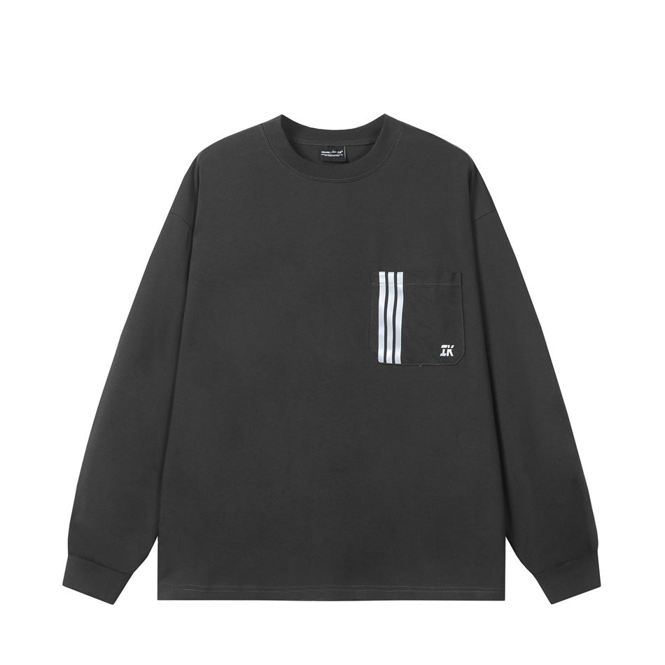 Dark gray long-sleeve crew-neck top with chest pocket and three vertical white stripes, flat front view