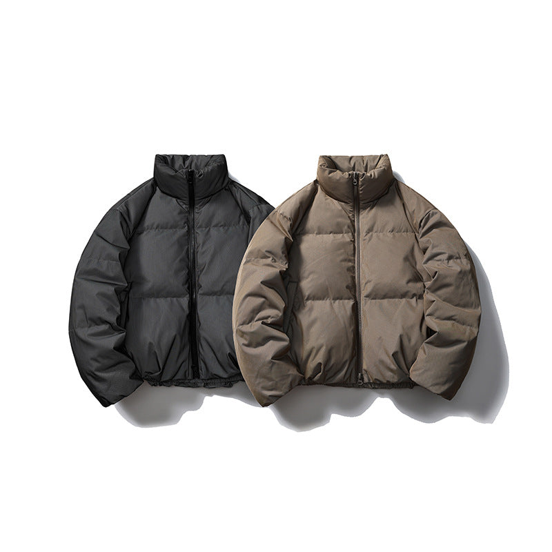 Two front-view puffer jackets displayed side by side in black and taupe.