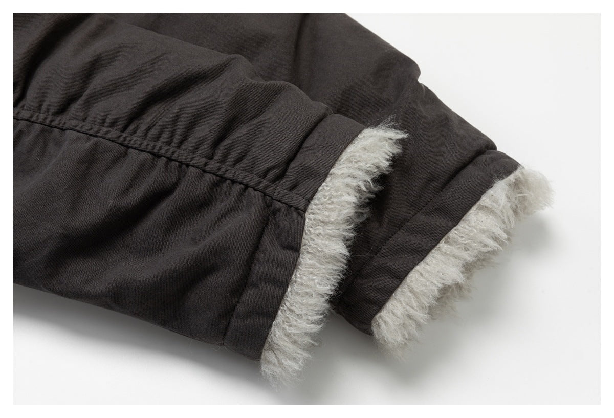 Close-up of charcoal cuffs with thick light gray fuzzy lining.
