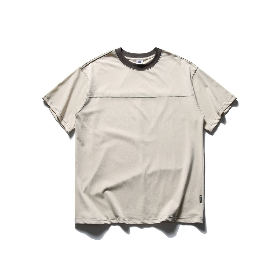 Beige short-sleeve crewneck T-shirt with dark gray collar and contrast stitching, flat lay front view