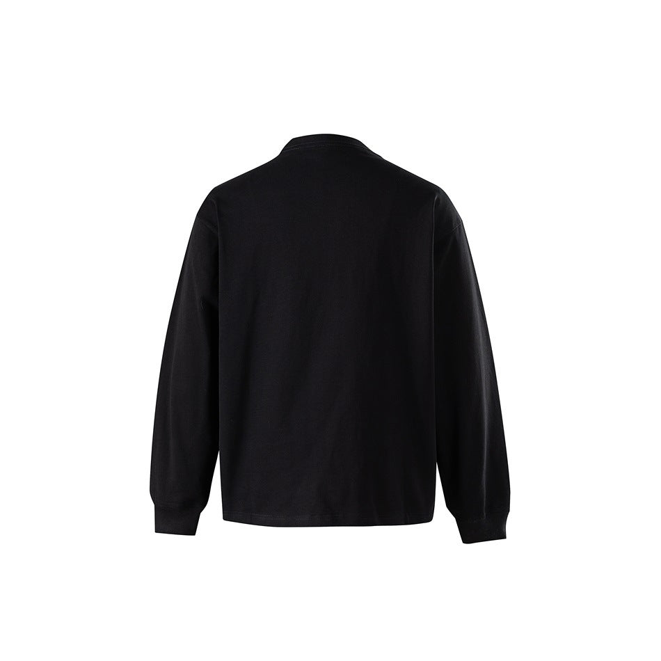 Back view of a plain black long-sleeve crewneck tee with ribbed cuffs and dropped shoulders