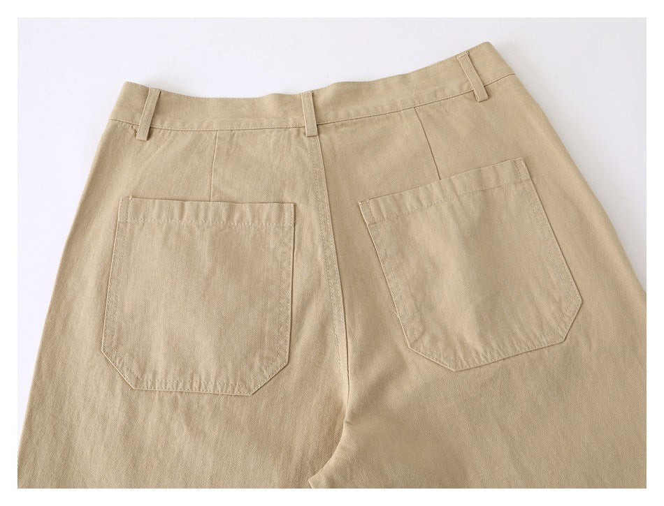 Rear upper view of beige pants showing two large patch pockets, belt loops, and the waistband.