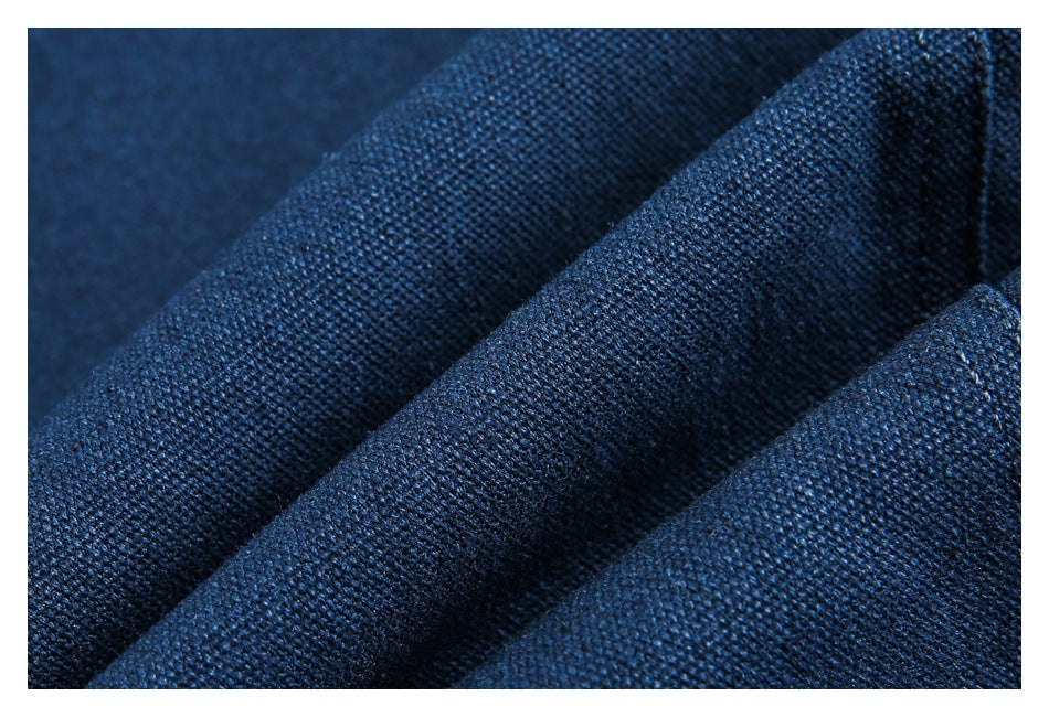 Macro view of the textured weave of dark blue fabric.