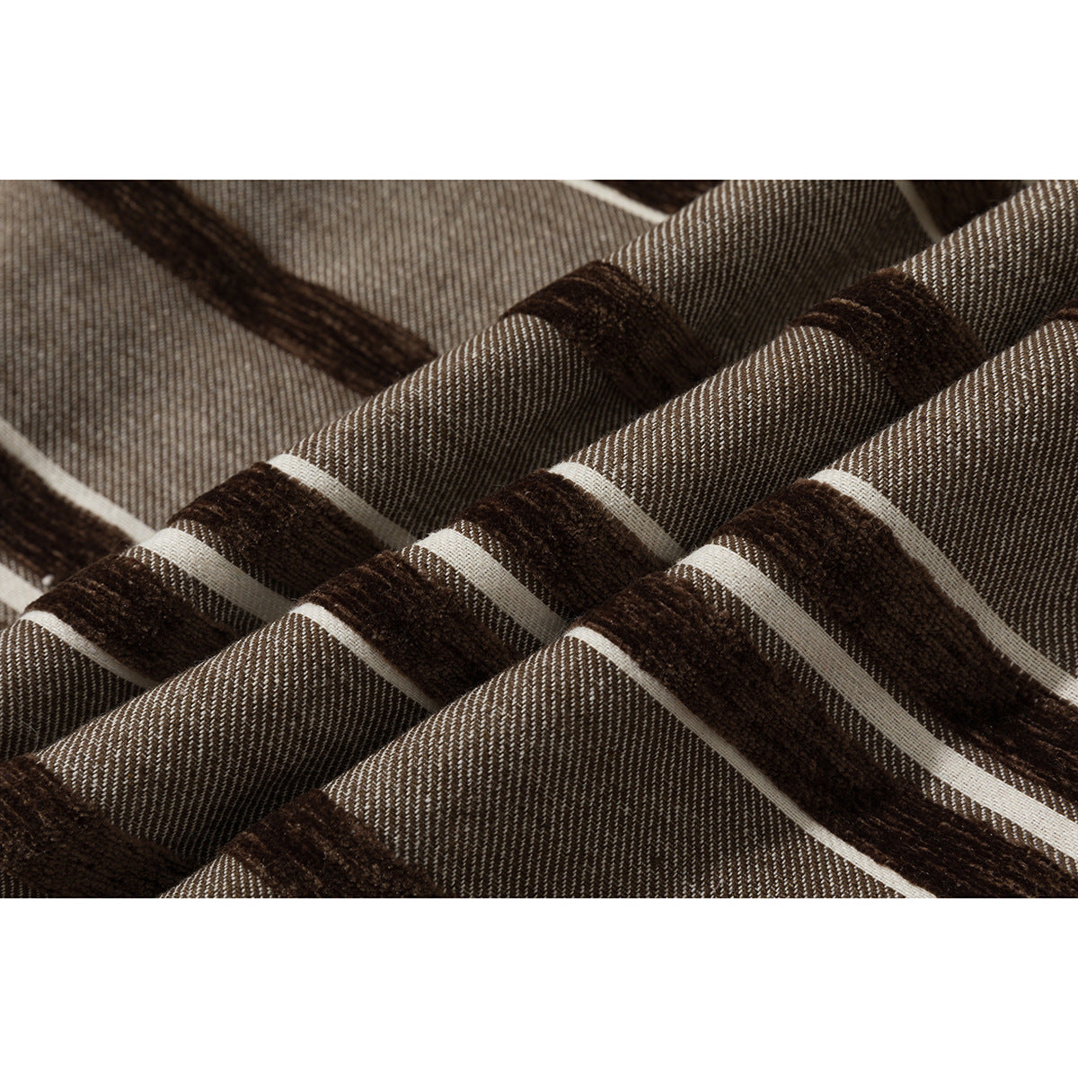 Close-up showing the brown, cream, and gray striped fabric and its textured surface.