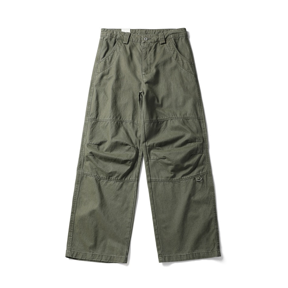 Front view of army green wide-leg work pants with stitched knee panels, belt loops and a D-ring detail