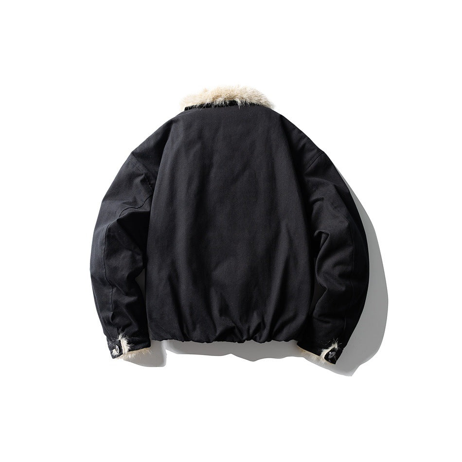 Back view of black jacket with cream fur-style collar, elastic hem and fur-trimmed button cuffs, laid flat