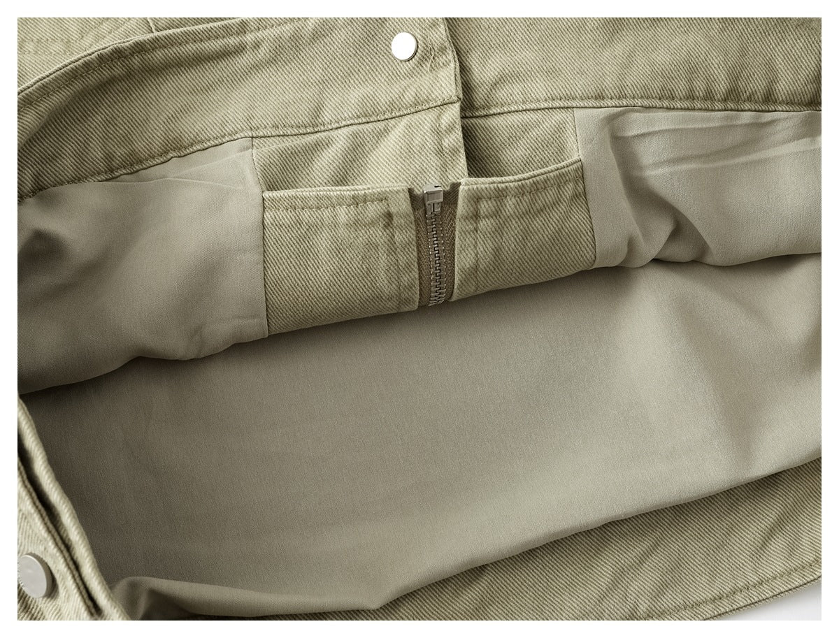 Inside view of the khaki jacket showing smooth lining, an interior zipper, and snap closures.