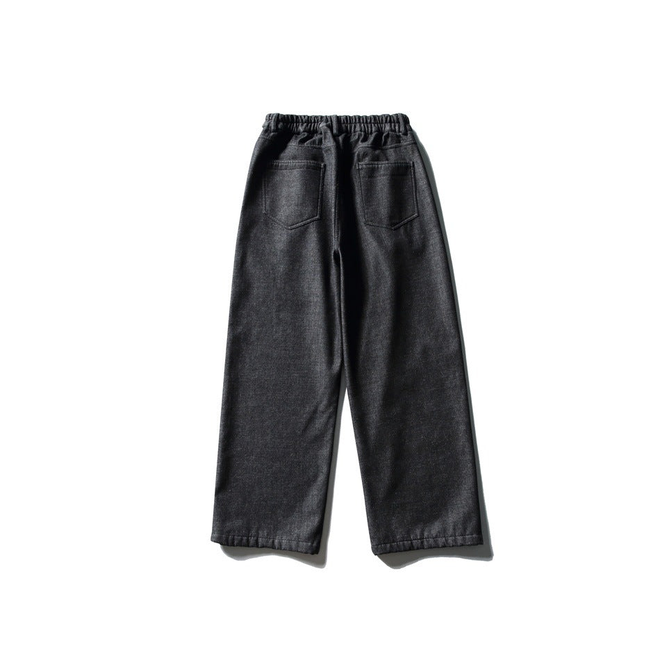 Back view of dark charcoal wide-leg denim-style pants with elastic waistband and two back patch pockets