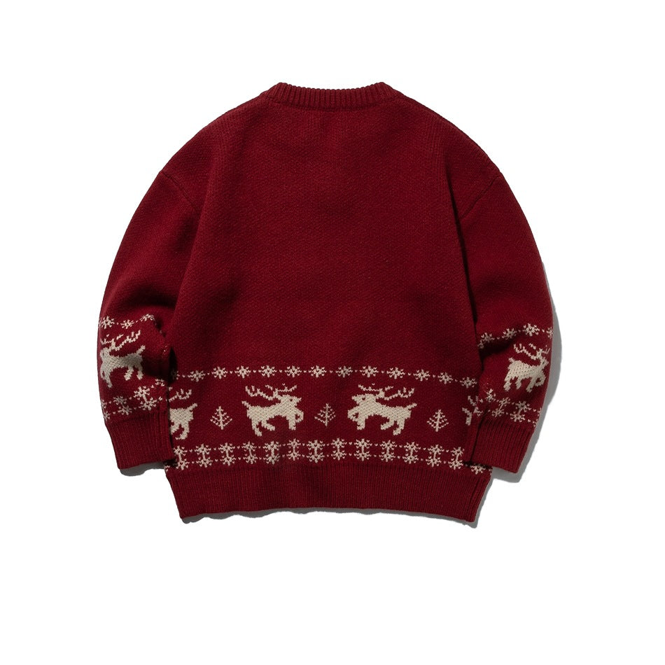 Back view of a burgundy sweater with cream reindeer and winter motifs around the hem and sleeves.