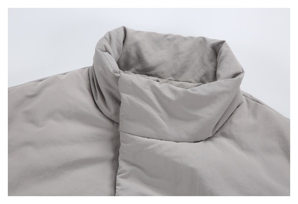Close-up of the jacket's high, folded collar and upper back in light gray.