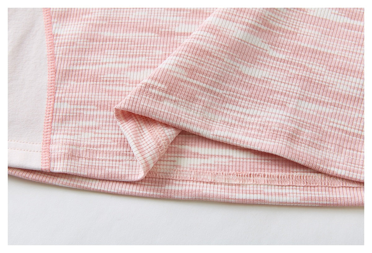 Close-up of the pink-and-white striped garment's folded hem and visible overlock stitching.