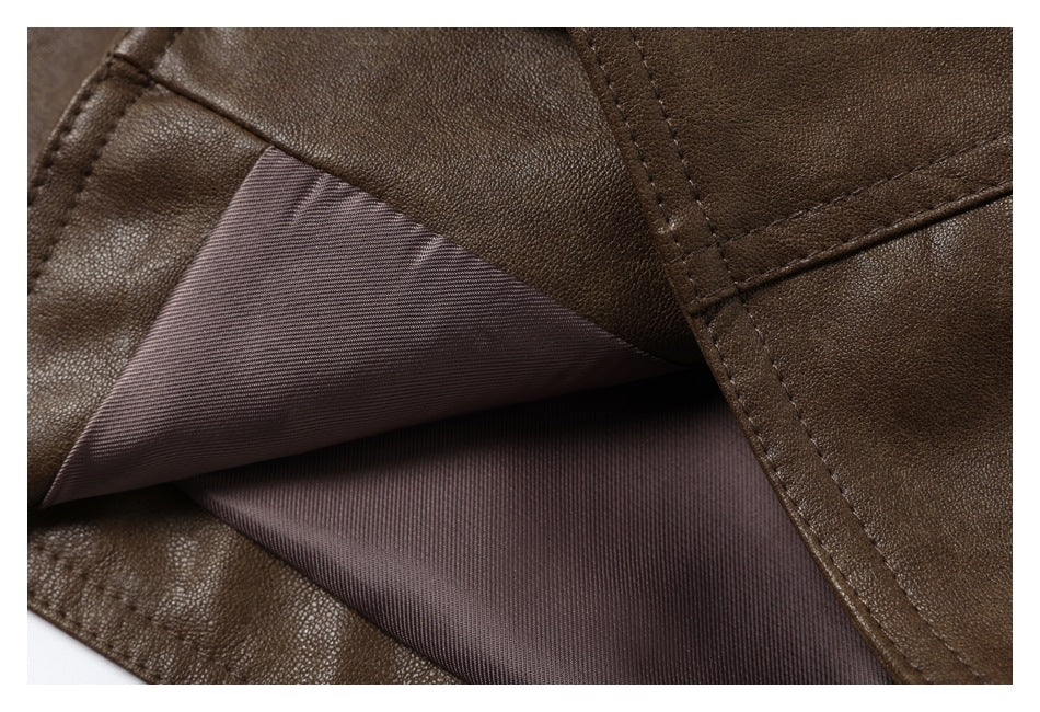 Close-up showing the brown garment's pebbled exterior, stitched seams, and dark inner lining.