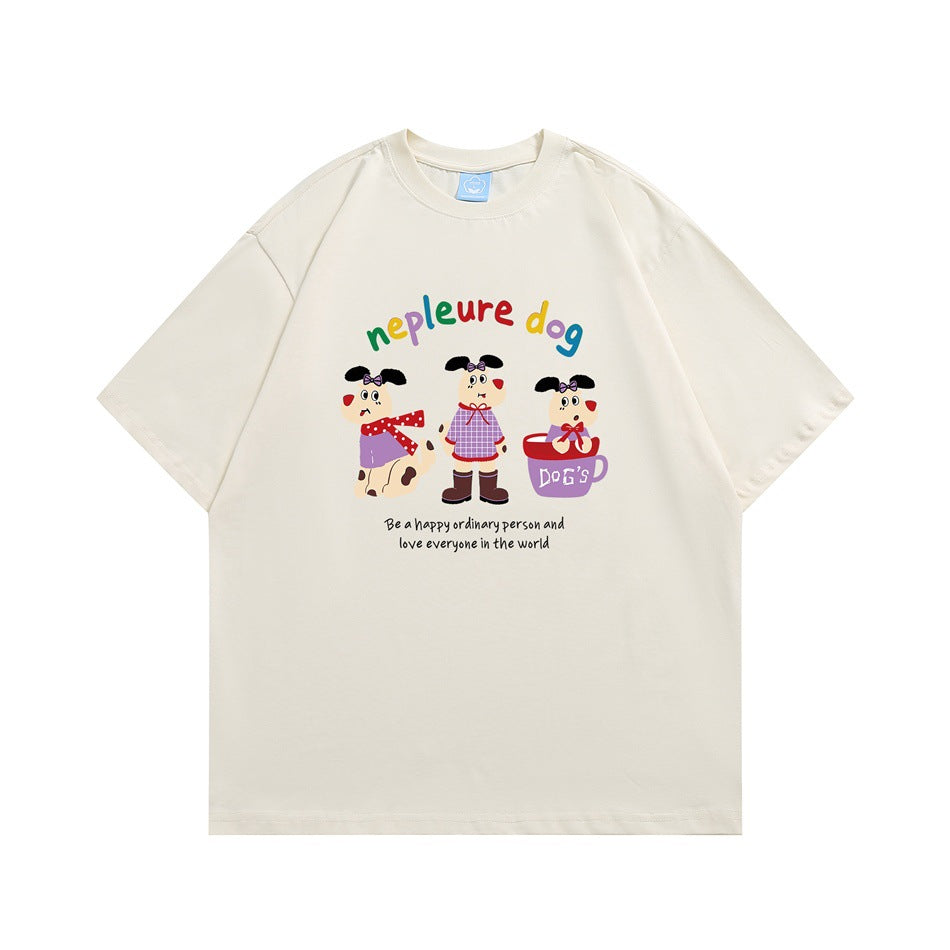 Cream apricot short-sleeve T-shirt with cartoon dogs, rainbow 'nepleure dog' lettering and a small slogan, flat lay