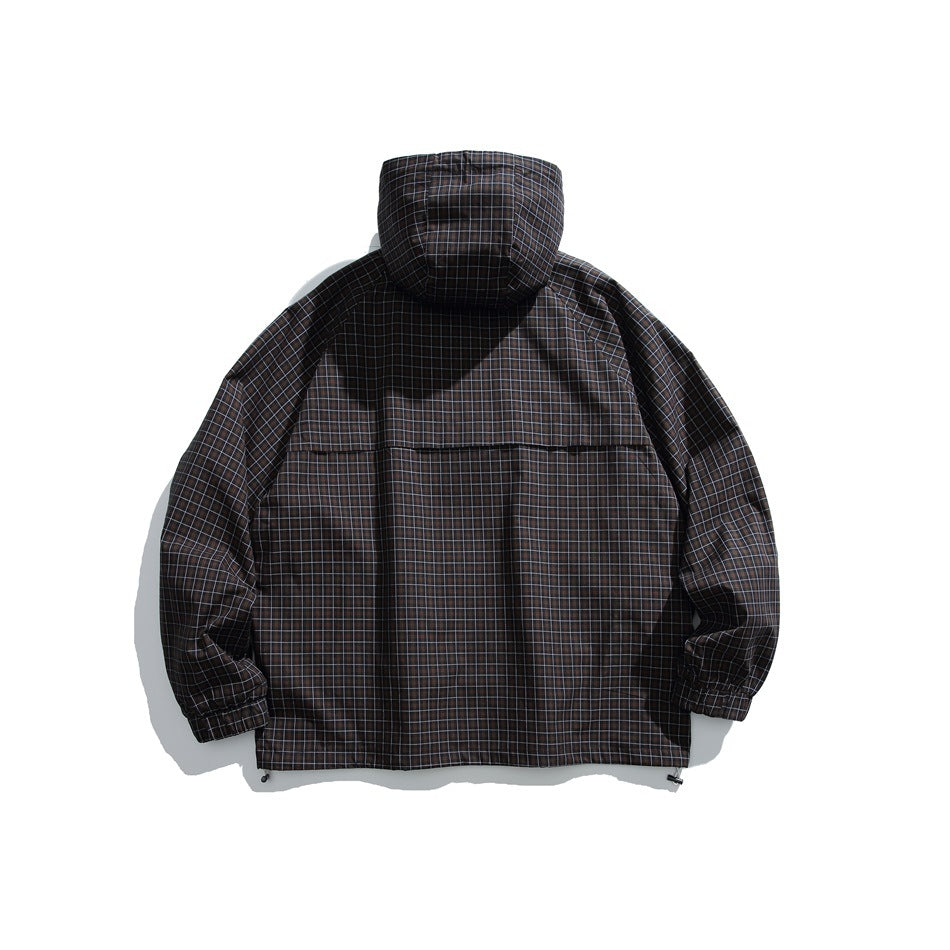 Back view of a dark grid-plaid hooded pullover jacket laid flat, showing a horizontal back seam and adjustable hem.
