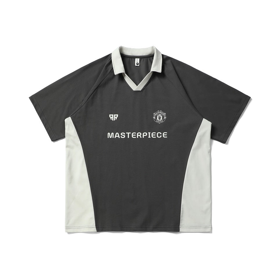 Dark gray short-sleeve polo-collar jersey top with cream collar, side panels and chest print, flat front view