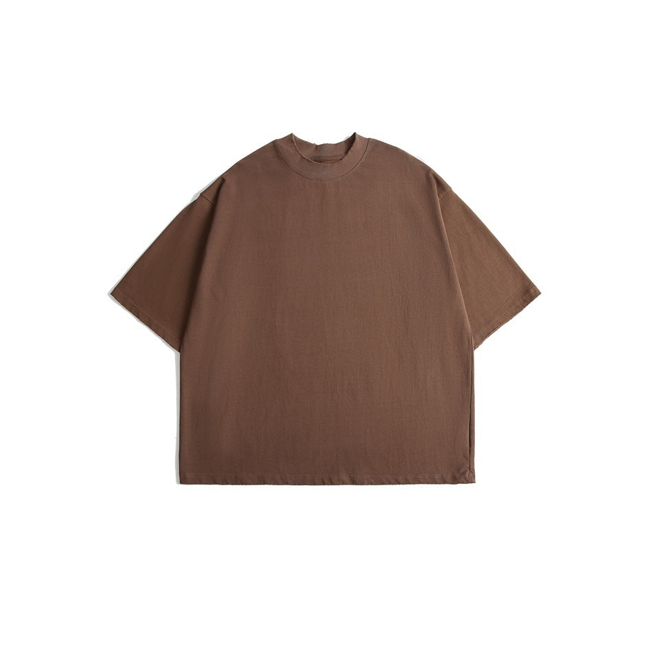 Front view of a plain brown oversized short-sleeve crew-neck T-shirt on a white background.