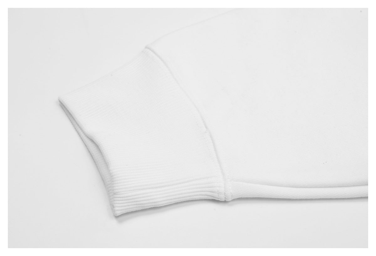 Close-up of a wide white ribbed cuff joined to the garment body.