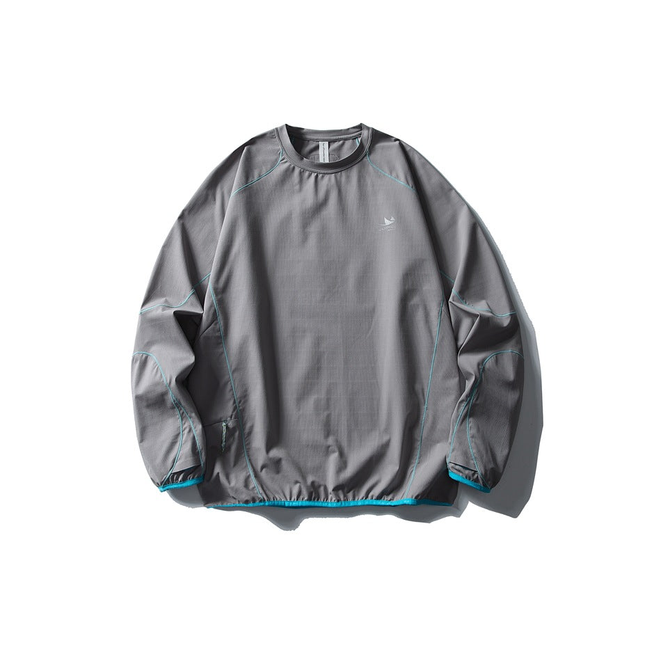 Medium gray long-sleeve crew-neck top flat lay with bright turquoise contrast piping and binding