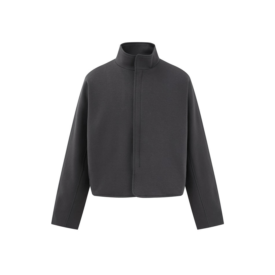 Dark gray cropped jacket with stand collar, covered front placket, long sleeves and curved hem on white background