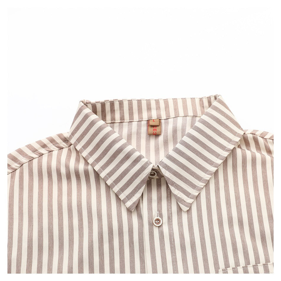 Close-up of the beige-and-white striped shirt collar, top button, and upper chest.