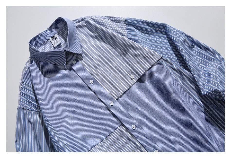 Close-up of a blue-and-white mixed-stripe shirt showing its button front, collar, and chest pocket.