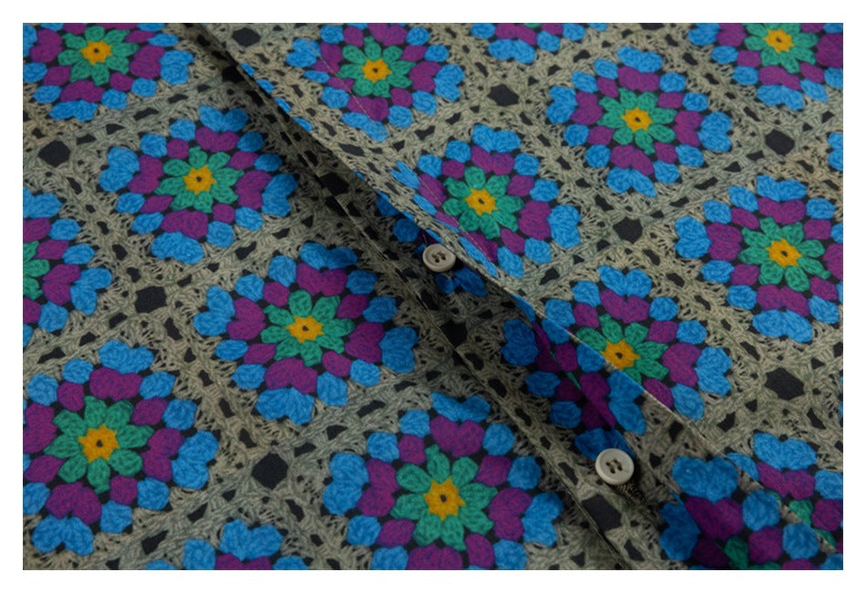 Close-up of the shirt's front placket and buttons amid a colorful floral geometric print.
