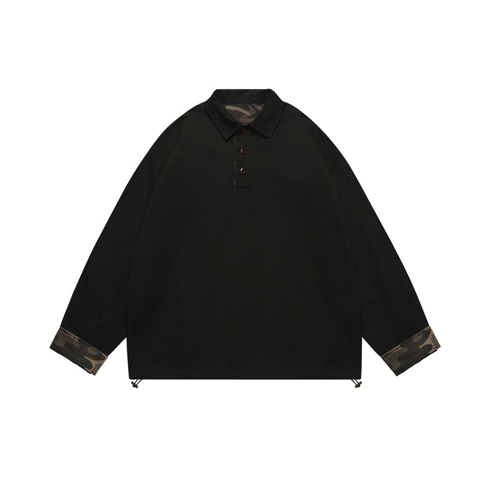 Black long-sleeve polo-collar pullover with three buttons, camouflage cuff facings and hem toggles, flat lay