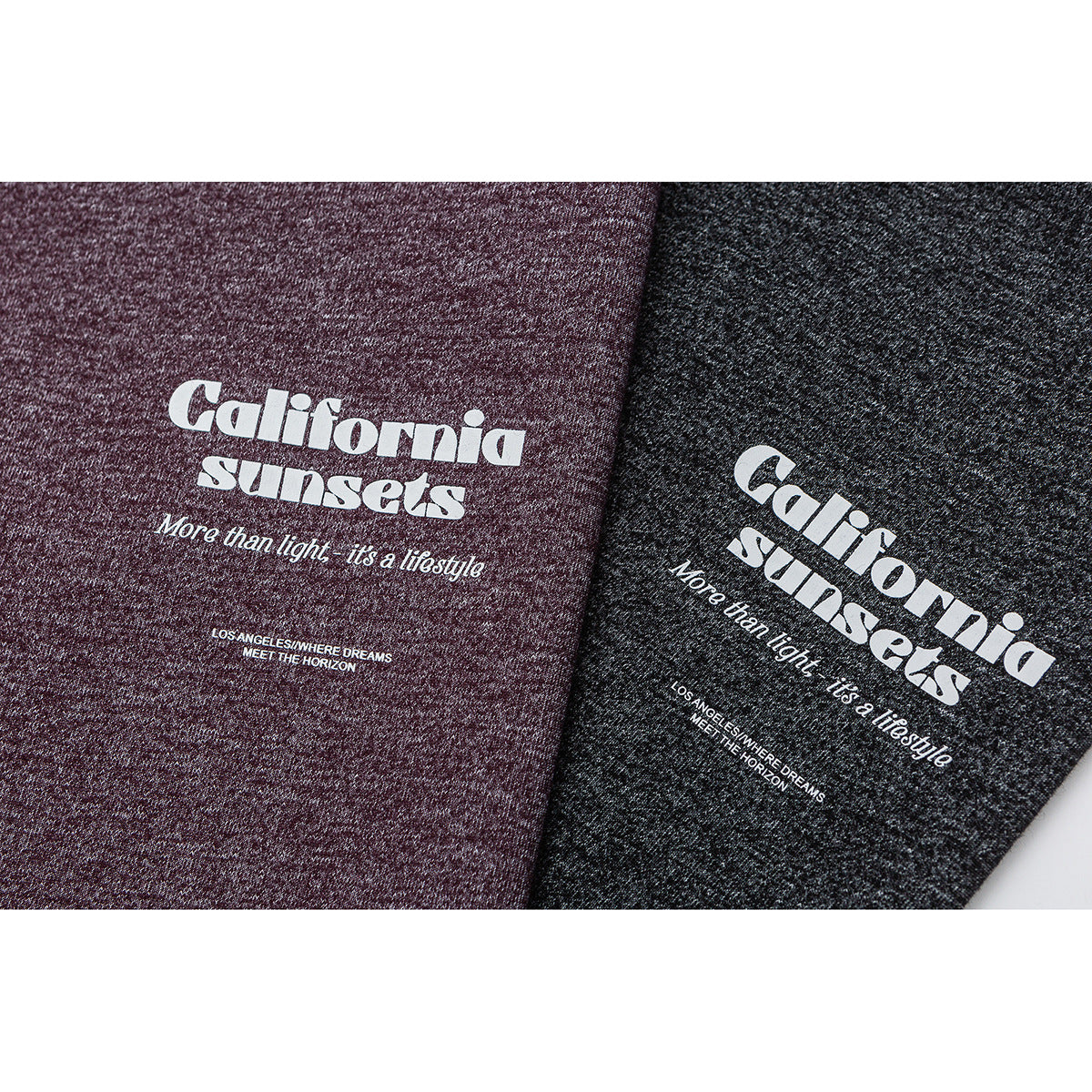 Close-up of white “California sunsets” lettering printed on heather burgundy and charcoal fabric.