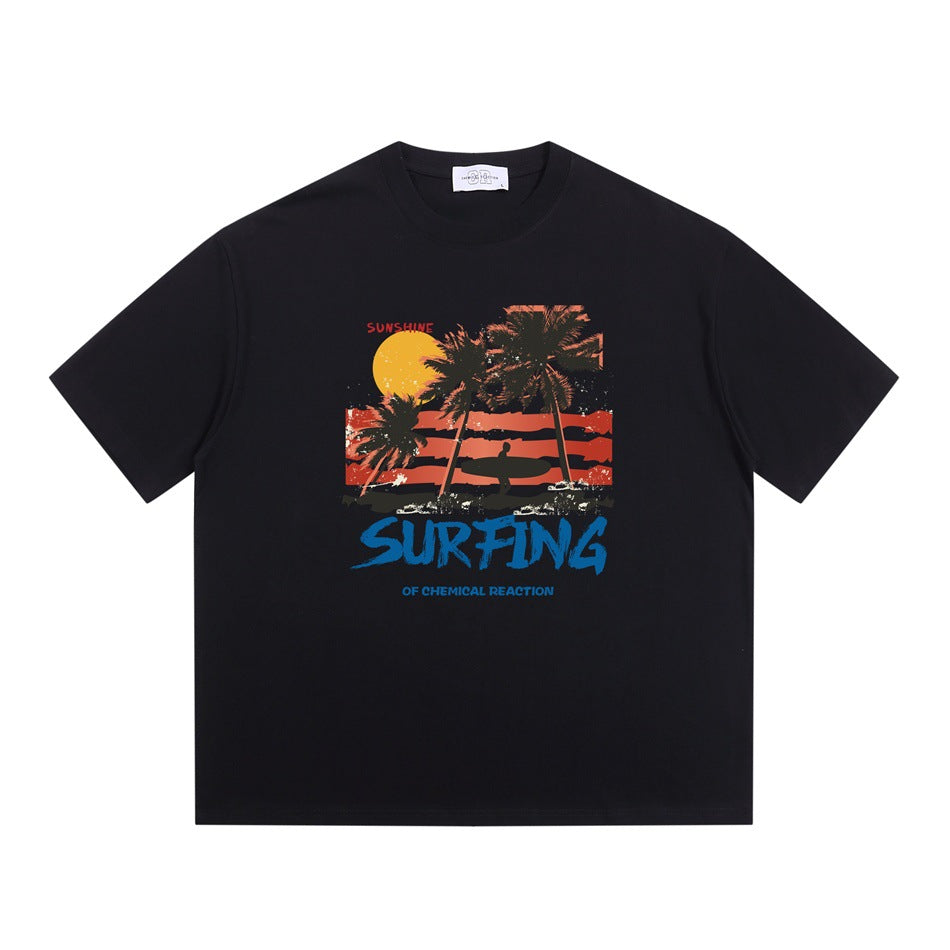 Black short-sleeve crew-neck T-shirt with palm tree sunset surfer graphic and blue SURFING lettering